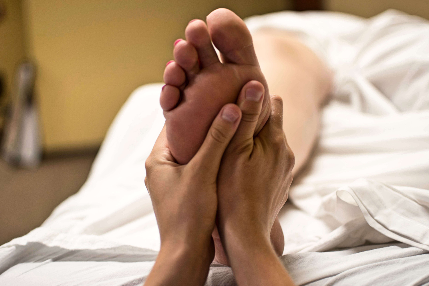 Person Massaging a Foot
